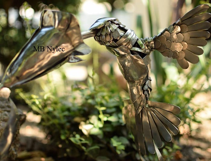 Hummingbird and flower figure forged