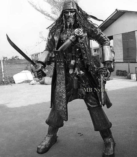 Life-size steel pirate sculpture with a sabre and a pistol