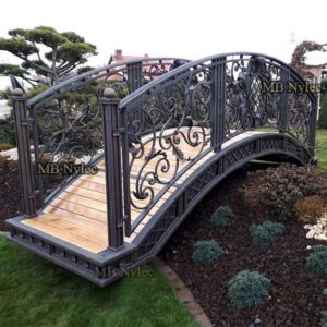 Ornate wrought iron garden bridge