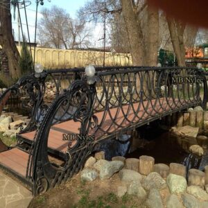 Decorative park bridge with lamps