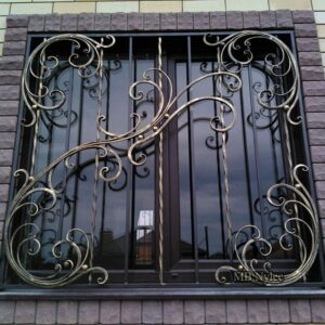 Window grille with gilded scrolls