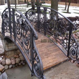 Arched wrought iron garden bridge
