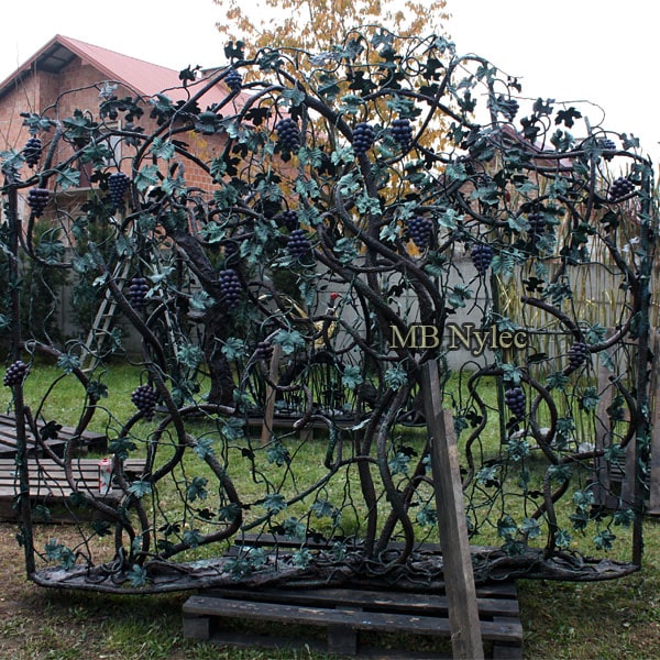 Forged steel fence with a grape scene
