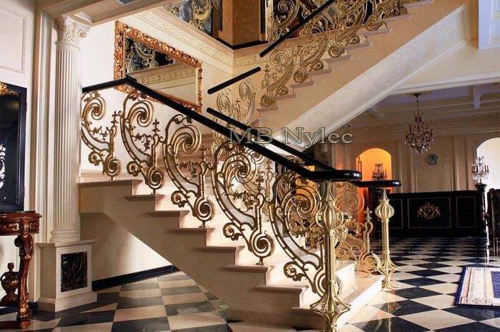 Forged stair railing with wooden handrail
