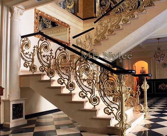 Forged stair railing with wooden handrail
