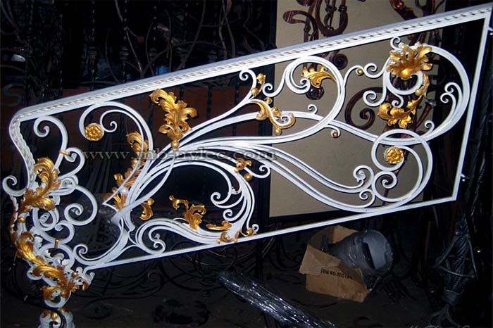 Wrought iron stair railing in white