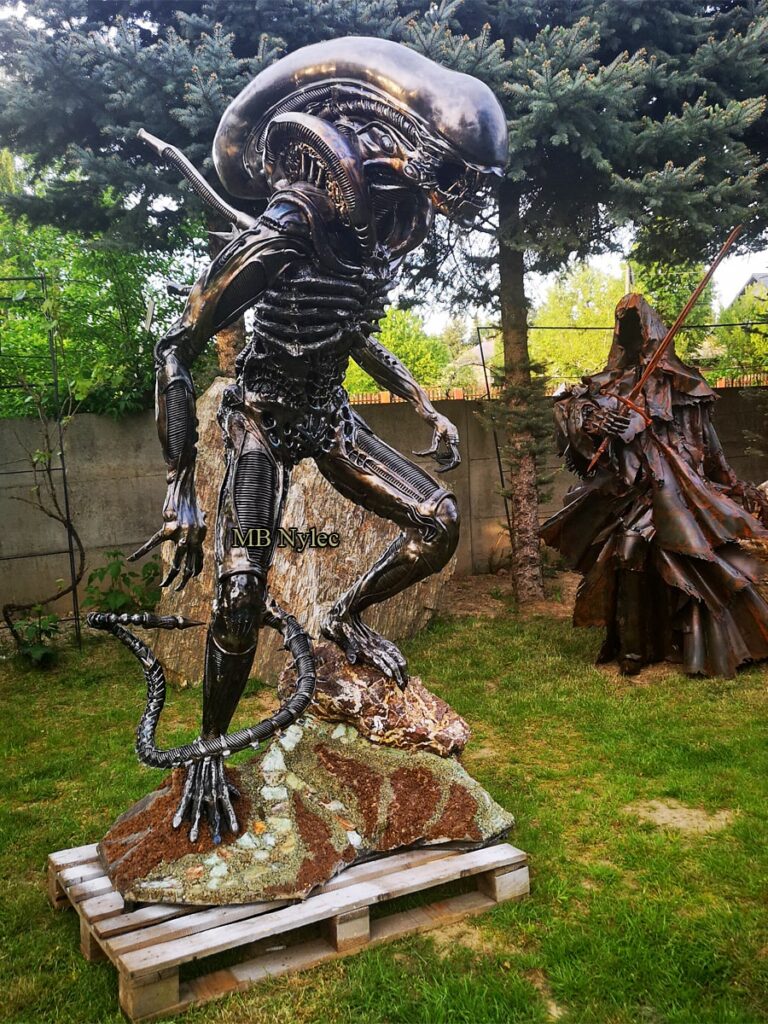 steel statue of an alien
