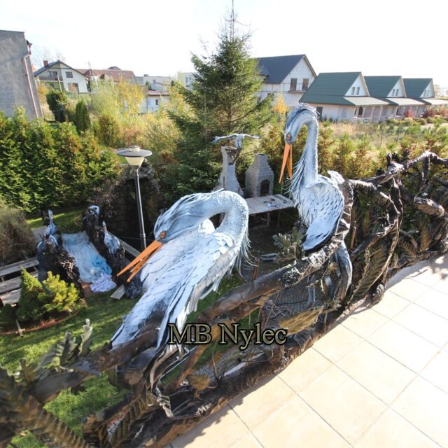 3D railing with two steel herons and flowing branches