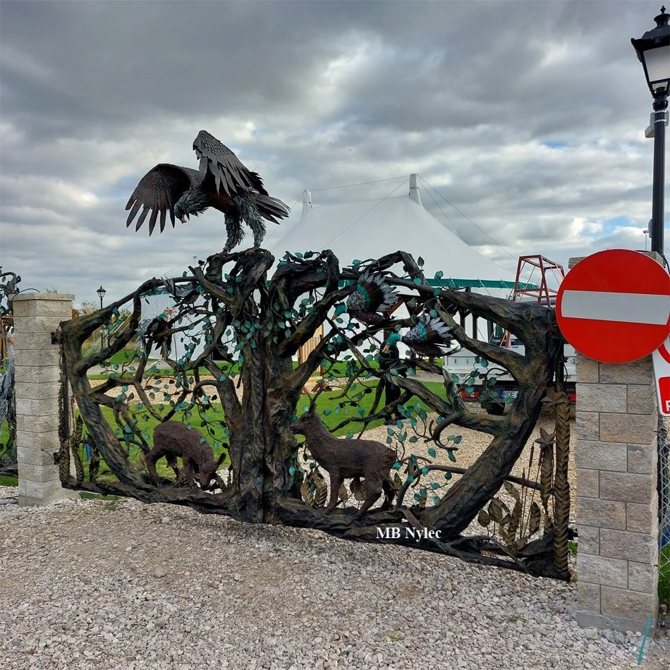 3D steel entrance gate with an eagle on top and forest scene