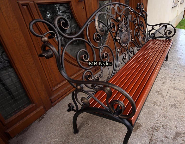 Angled view of the heraldic forged bench MK1B with wooden slats
