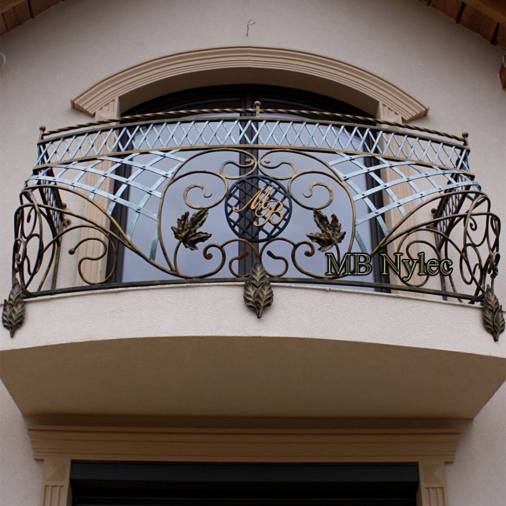 Curved balcony railing BA10 with a central medallion bearing the owners' initials