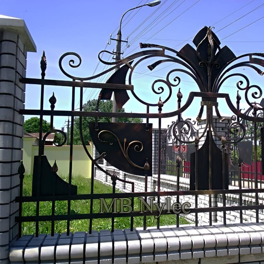 Front fence BP255 with bold forged scrolls, spears and solid black accents in each panel