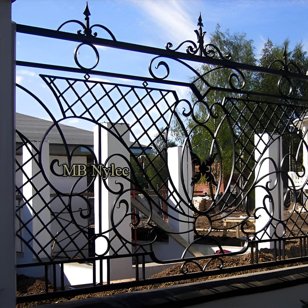 Classic forged fence BP222 with a diamond lattice crest and a large scrolled circle