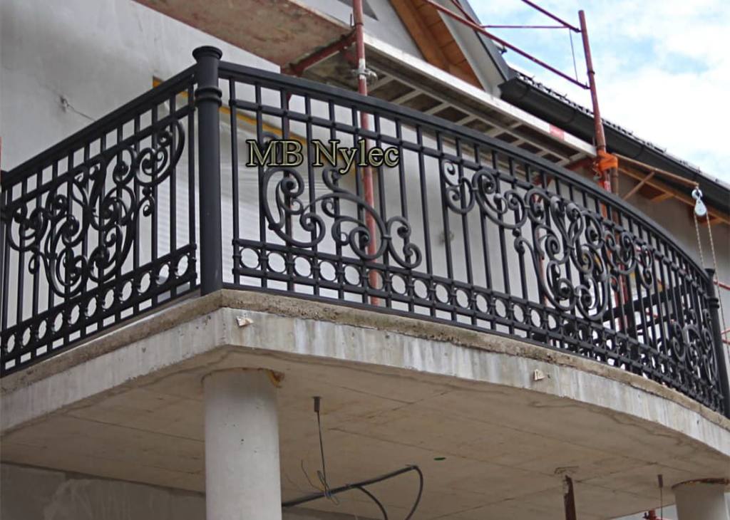 Elegant curved forged balcony BA49 with vertical bars and scroll panels above columns