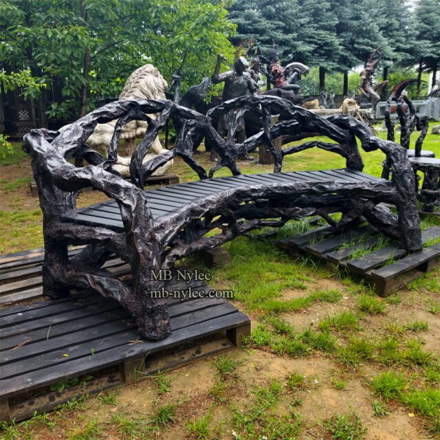 Front view of a curved steel bench made of forged limbs