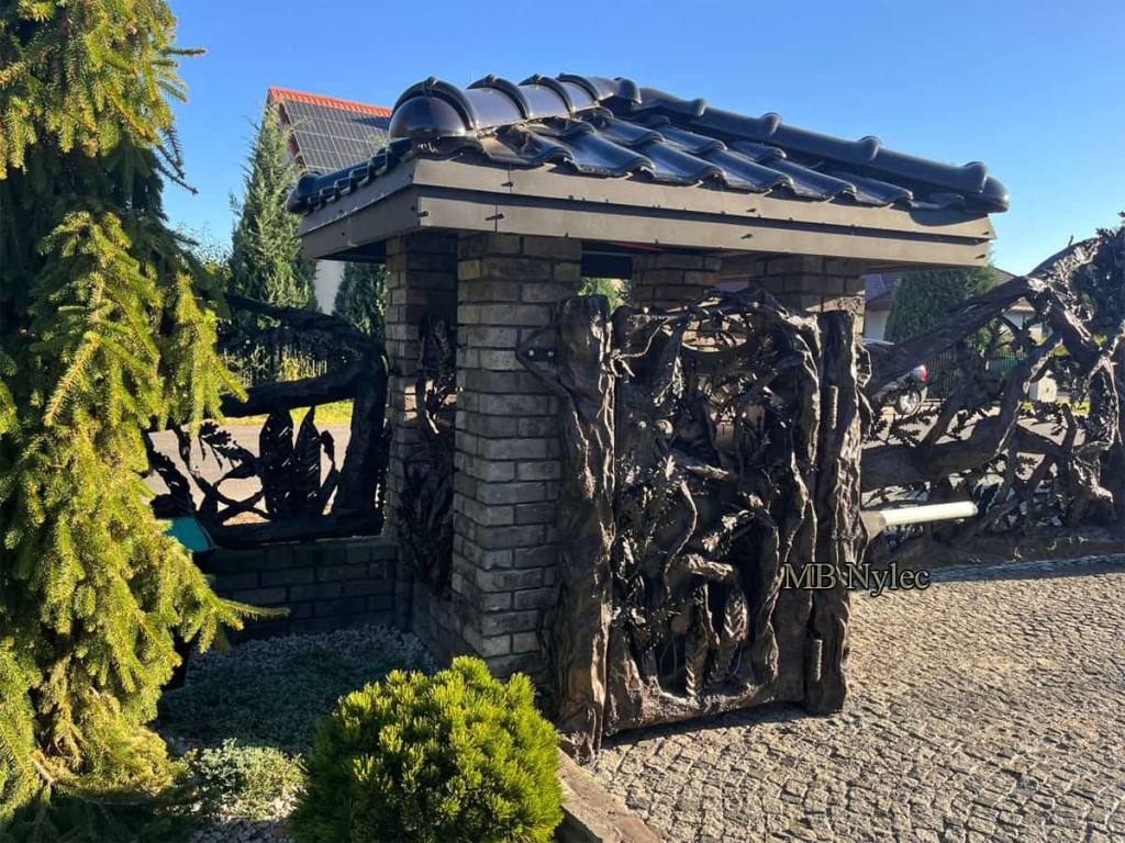Designer forged branch gate in a brick bin store enclosure with a tiled roof