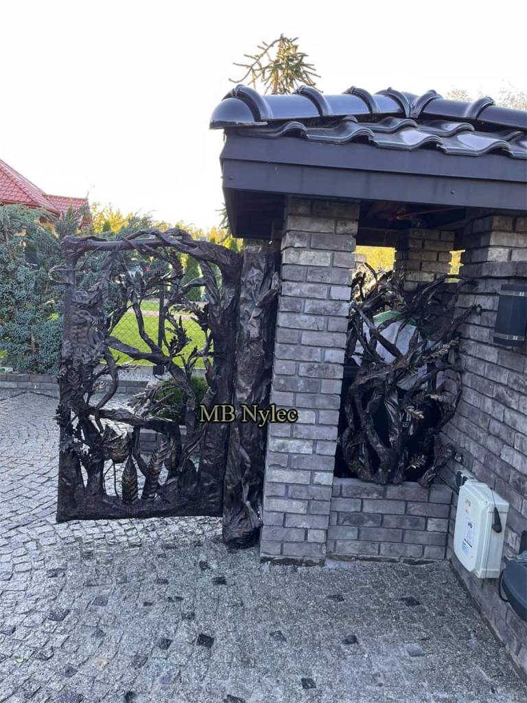 Designer steel gate closing a waste container shelter