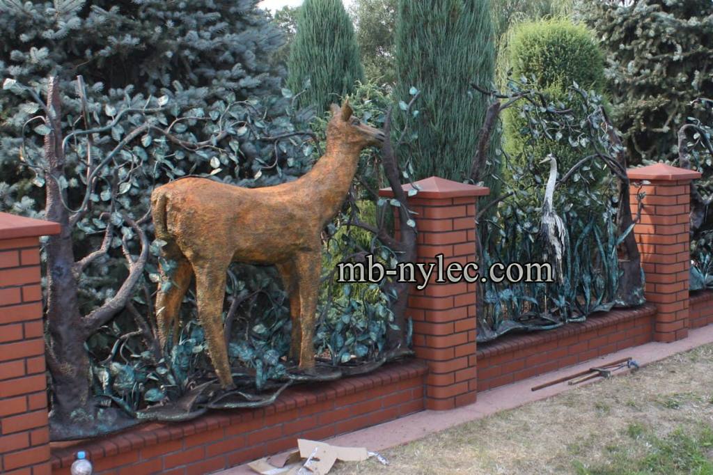 Forged fence span BM22 with a doe standing between steel trees at a farm stay