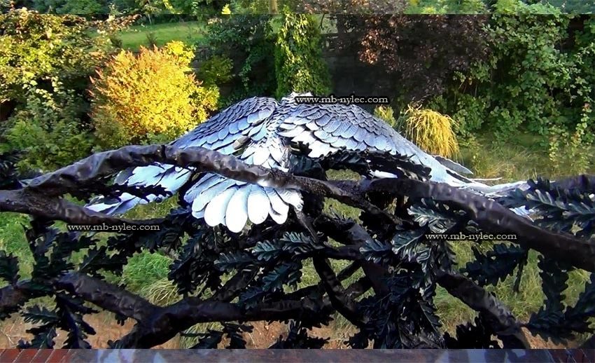 Detail of balcony railing BA40 with forged oak branches and the eagle's wing