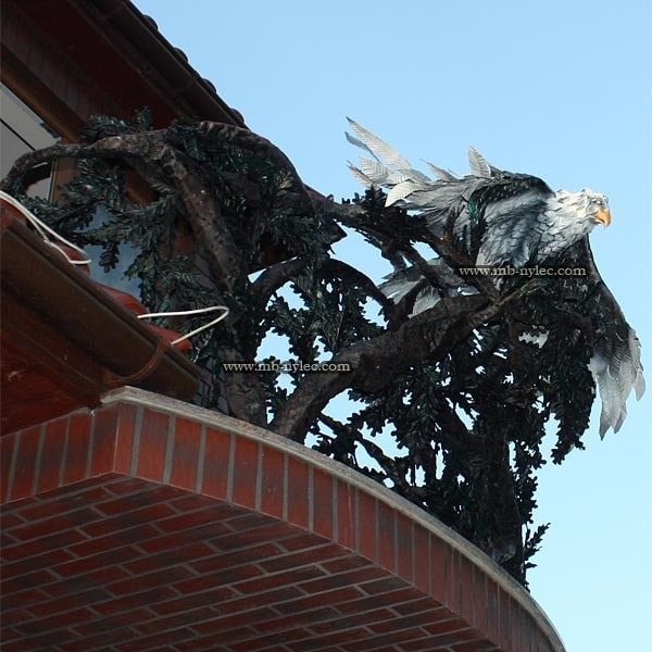 Side view of the forged eagle and tree railing BA40 on a brick balcony