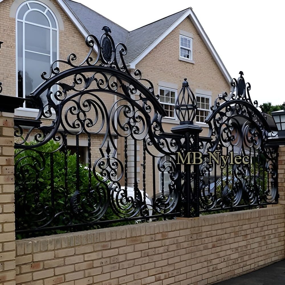 Forged fence BP235 with arched scrolled spans in front of a house