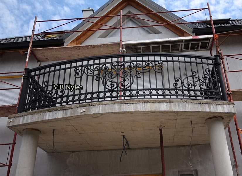 Forged balcony railing BA49 on a new house during construction