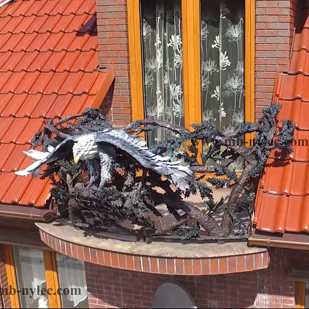 Forged eagle with silver wings taking off from balcony railing BA40