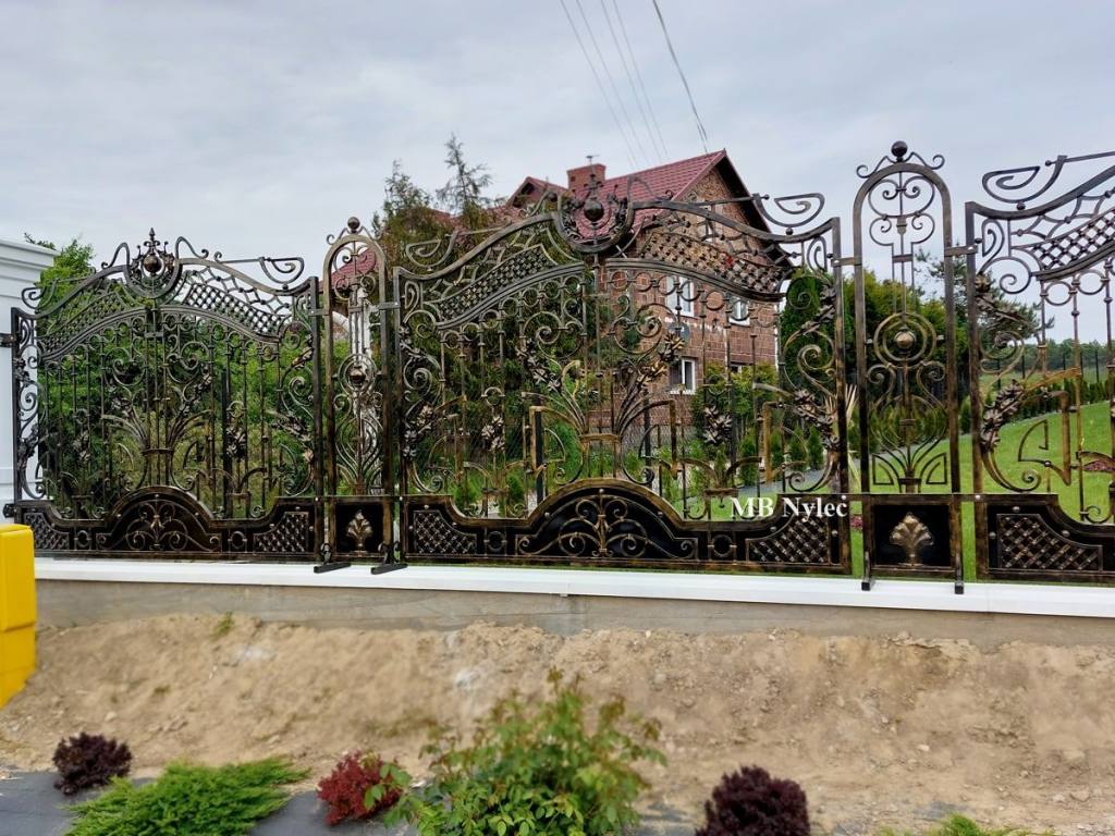 Forged fence along the full length of a garden