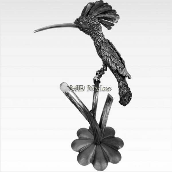 Hand-forged steel hoopoe with a raised crest perched on a stem with a flower-shaped base
