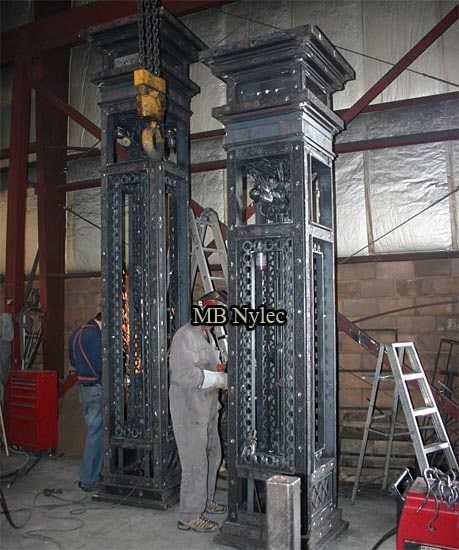 Two massive forged pillars S2 standing upright in our workshop before delivery