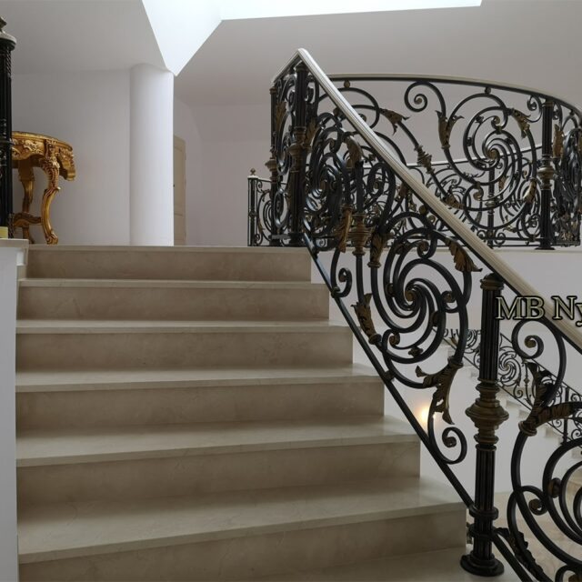 Forged railing following the curve of a staircase