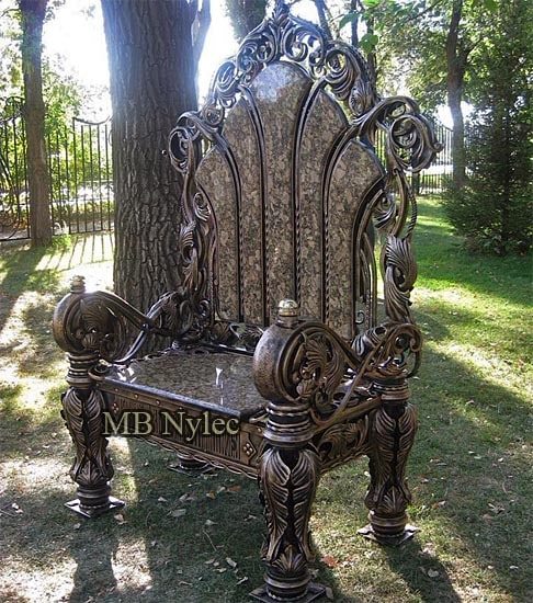 Forged throne MK54 with granite seat and back panels standing in a garden
