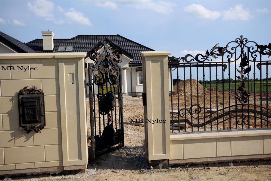 Forged wicket gate and a letterbox set into the pillar beside fence BP87