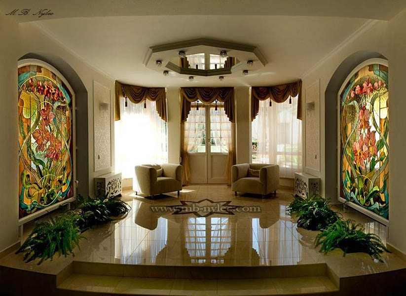 Glamour living room with floral stained glass panels on both sides of a bay window