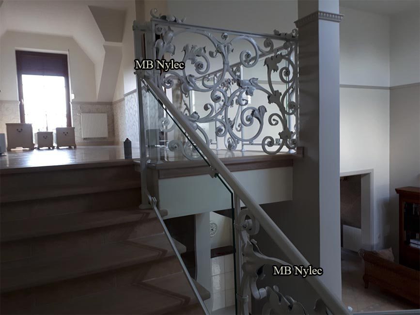 Glass and forged railing BA68 in a stairwell with a window