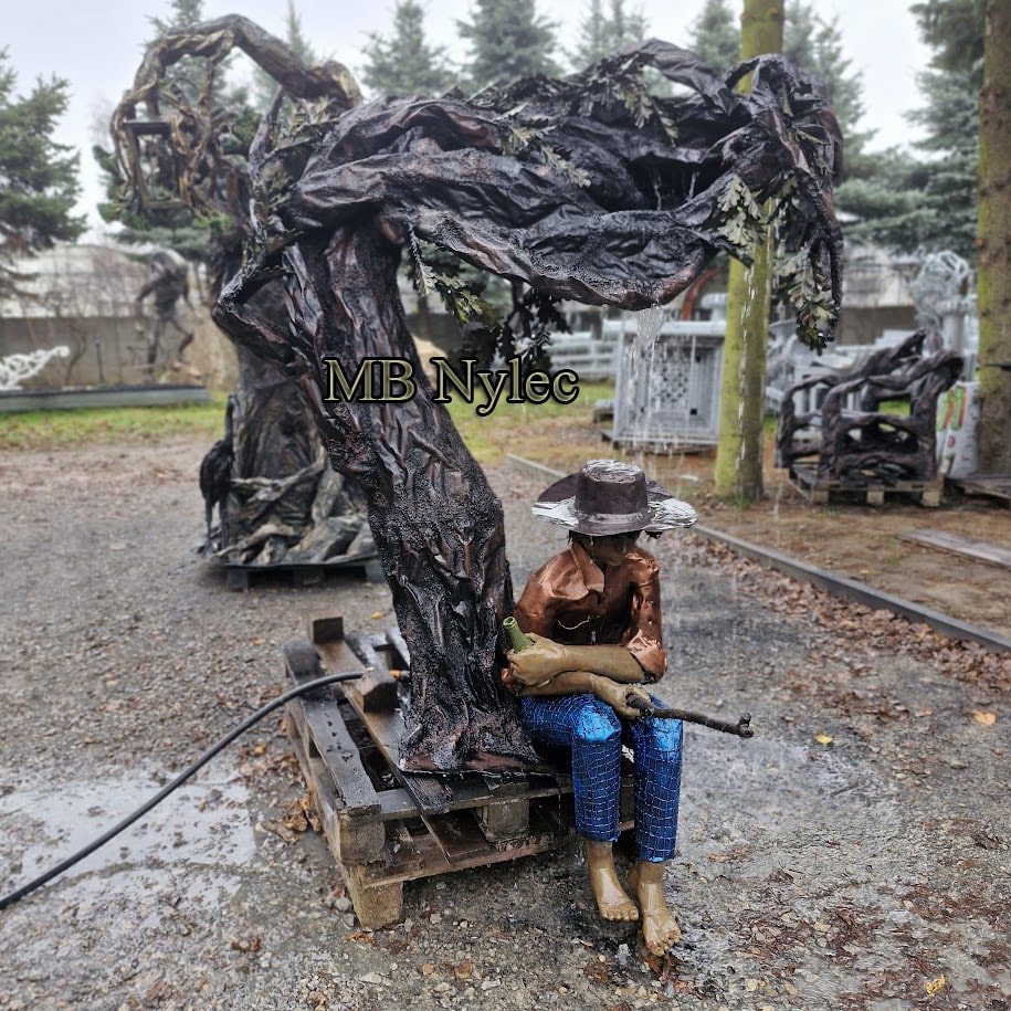 Gnarled steel tree sculpture with a seated hunter figure beneath it