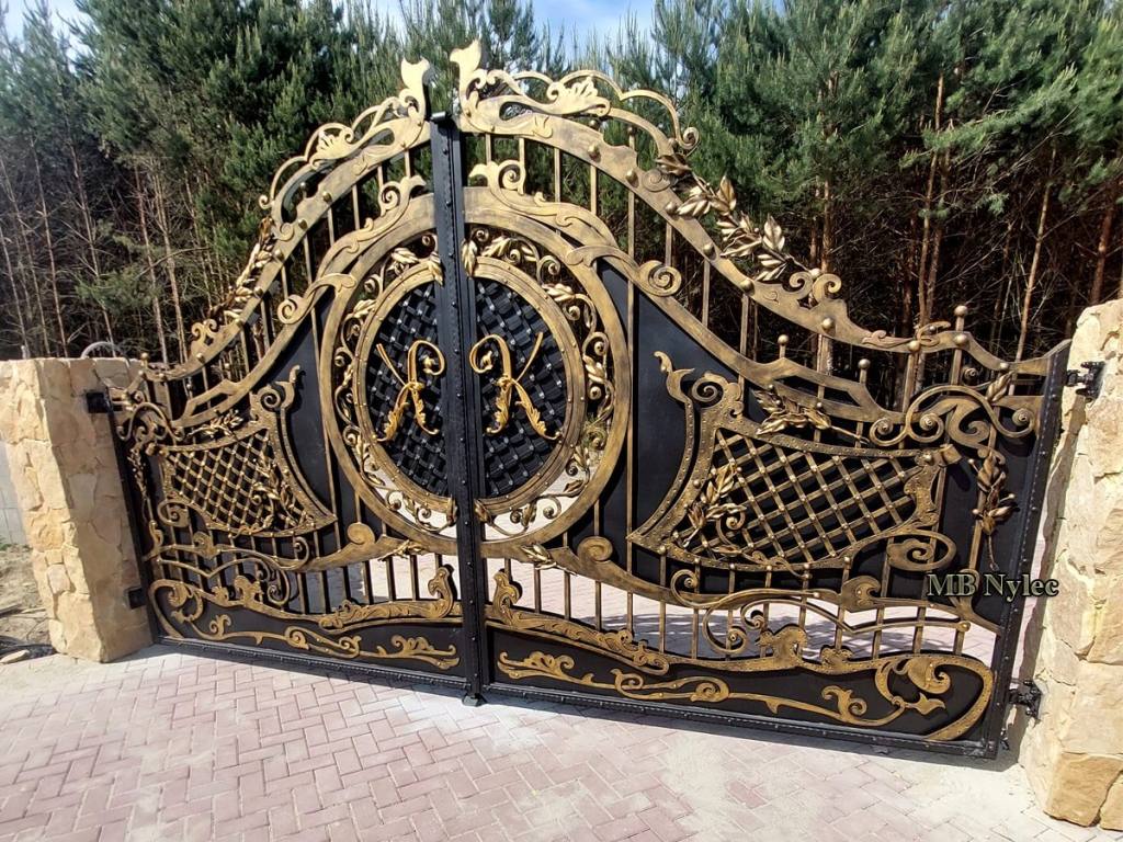 Gold and bronze privacy gate between stone pillars