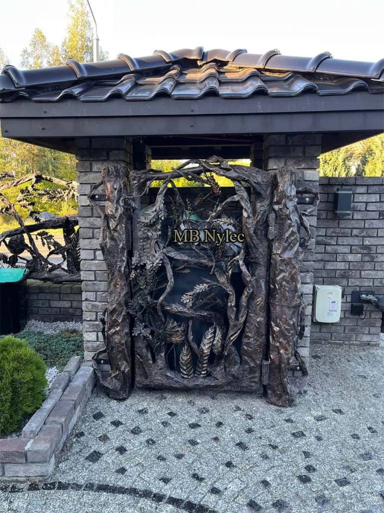 Hand-forged branch gate with posts shaped like tree trunks