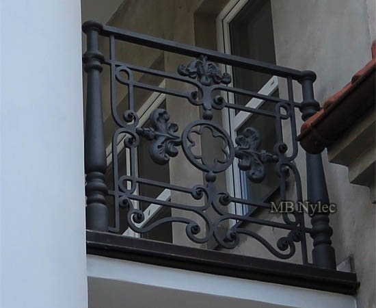 Heavy forged railing BA42 on a balcony beside a classical column