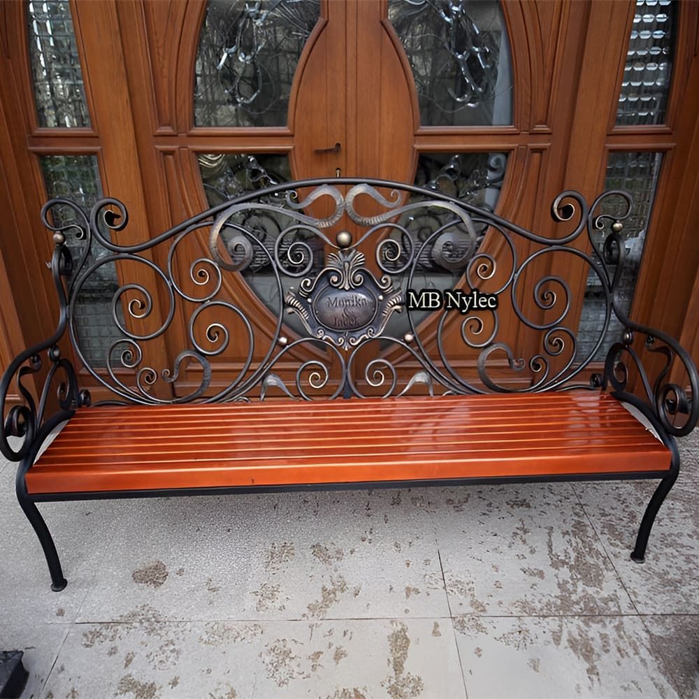Front view of the forged garden bench MK1B with a heraldic medallion
