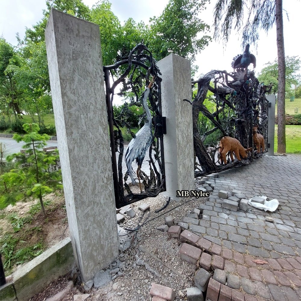 3D forged wicket gate with a heron looking upwards