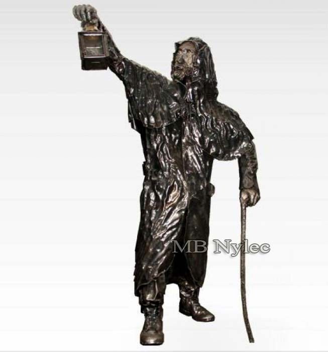 220 cm steel figure of a hooded lamplighter raising a lantern and leaning on a stick