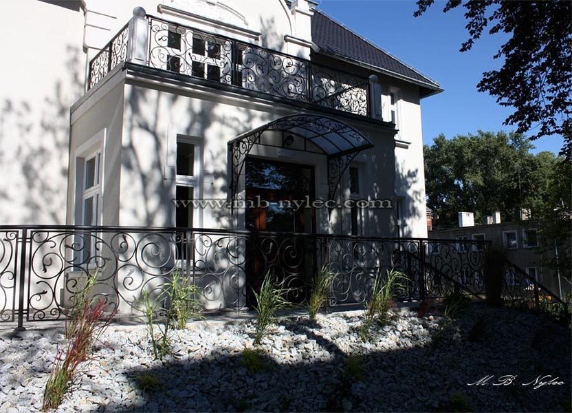 Hotel facade with balcony and terrace railings BA28 in the same scroll pattern