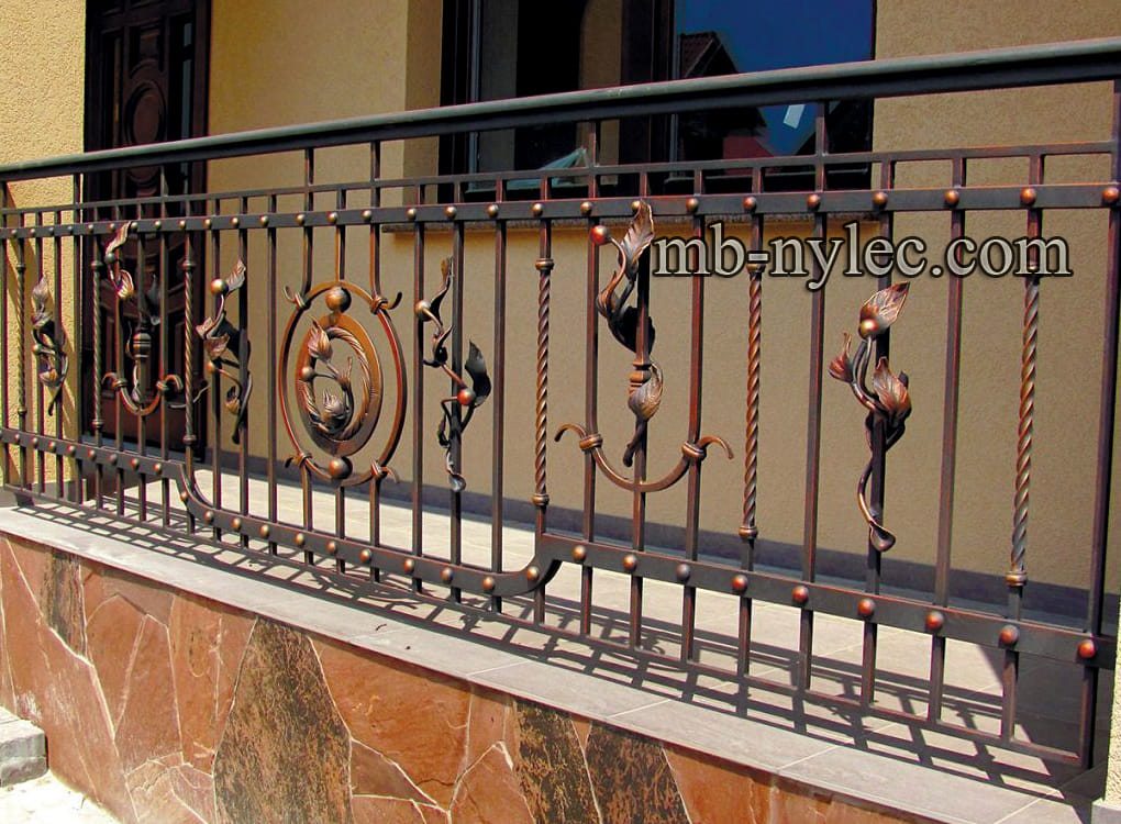 Light outdoor railing BWZ2 with twisted bars and copper-toned forged accents on a terrace
