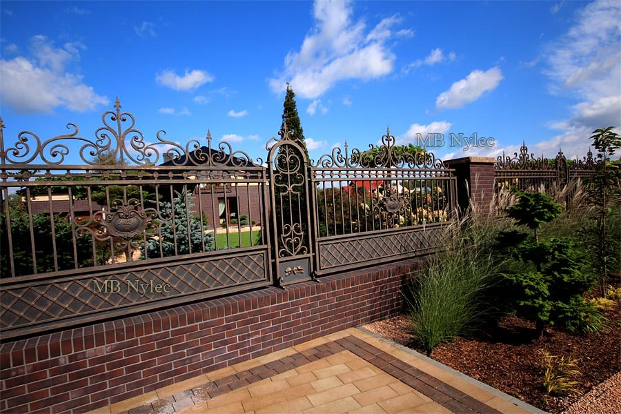 Wicket in fence BP54 framed by forged S4 pillars