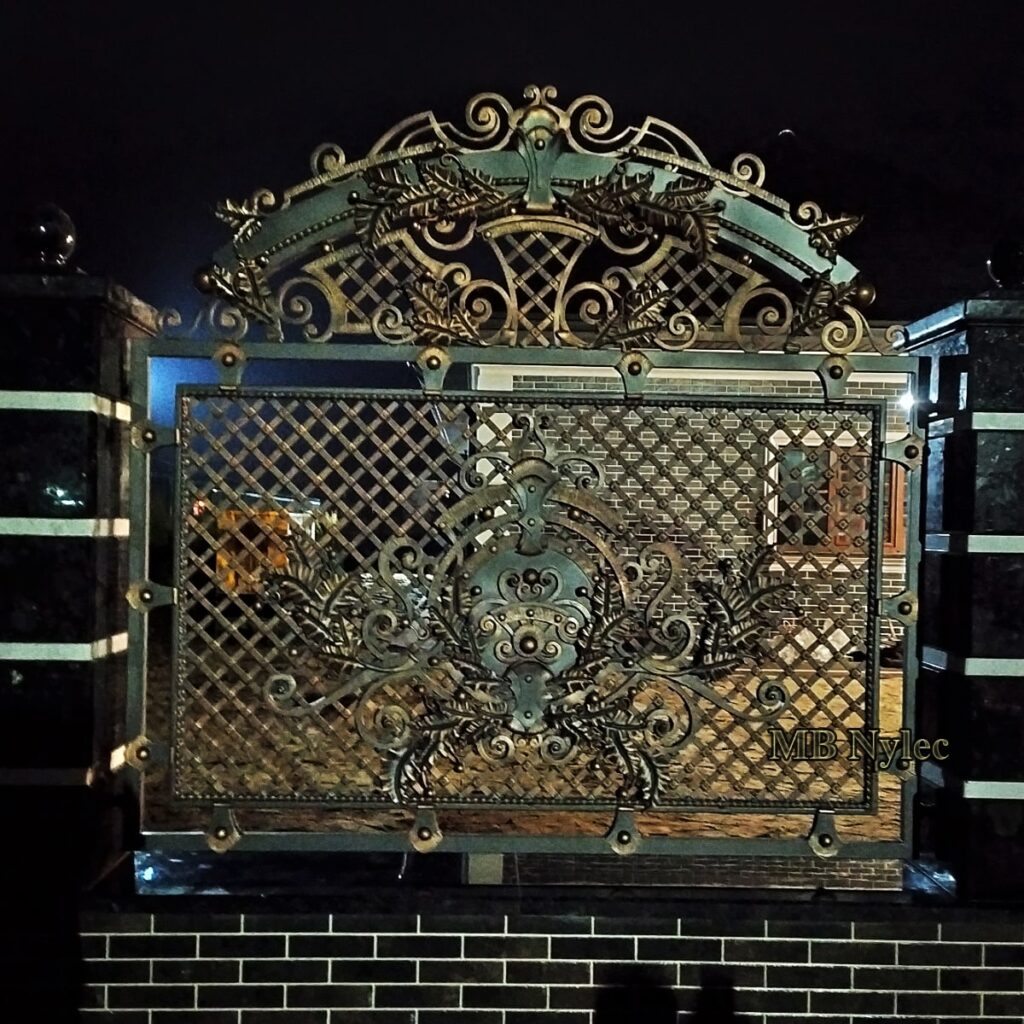 Massive forged fence panel with blacksmith lattice and gilded crest