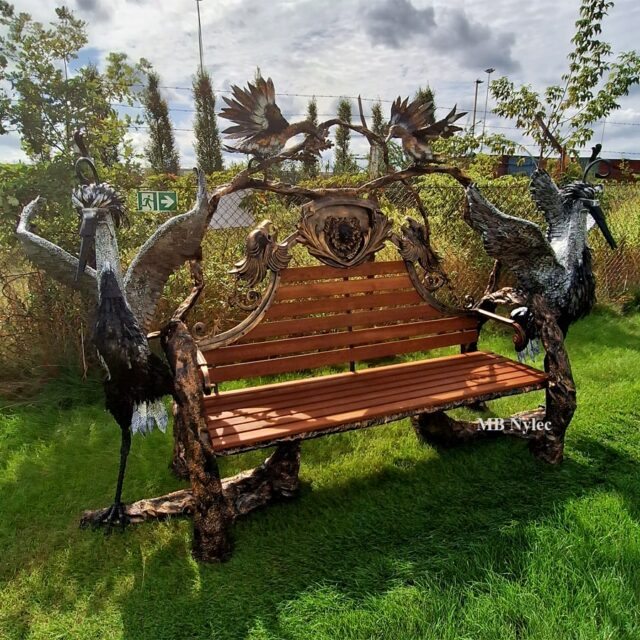 Metal sculpture garden bench with wild ducks and herons