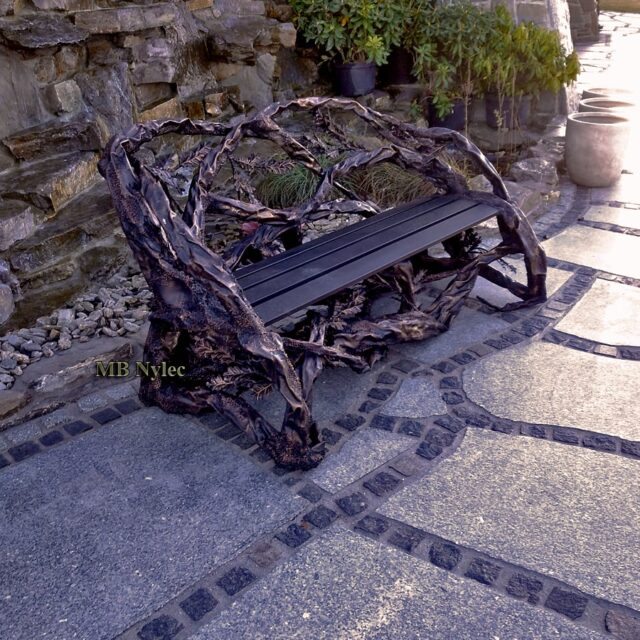 Metal sculpture bench in the shape of tree branches