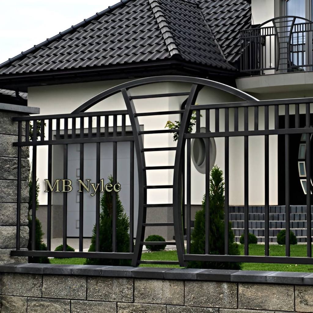 Modern metal fence BP244 with vertical bars and a sweeping curved band with an oval cut-out