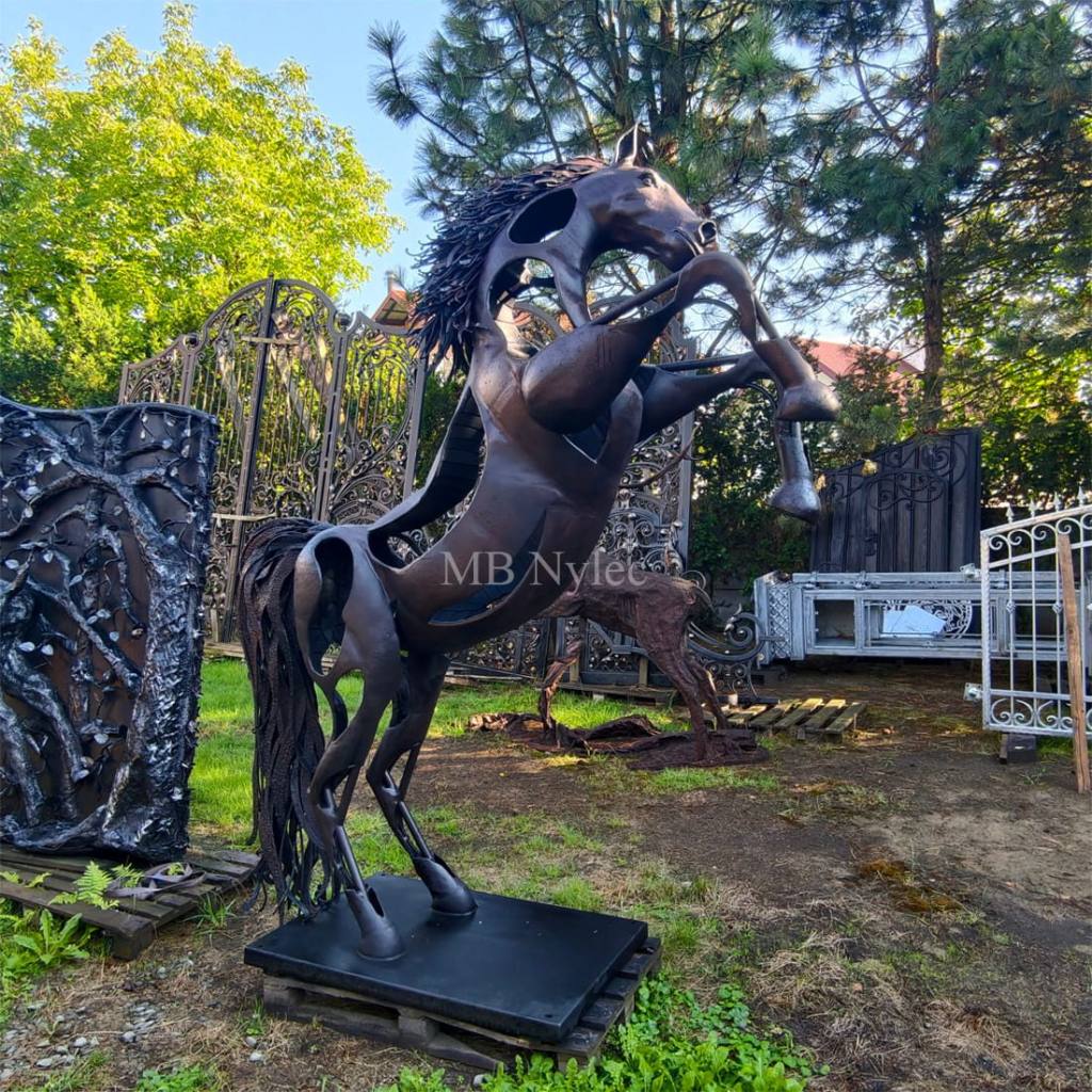 Modern steel sculpture of a rearing horse with a flowing mane
